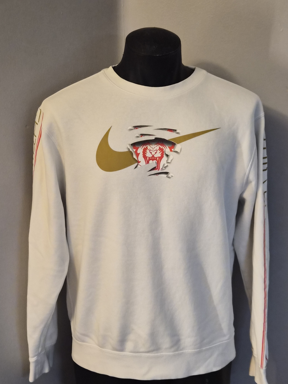 Nike Men's White Crewneck Sweatshirt with Gold Swoosh and Red Accent